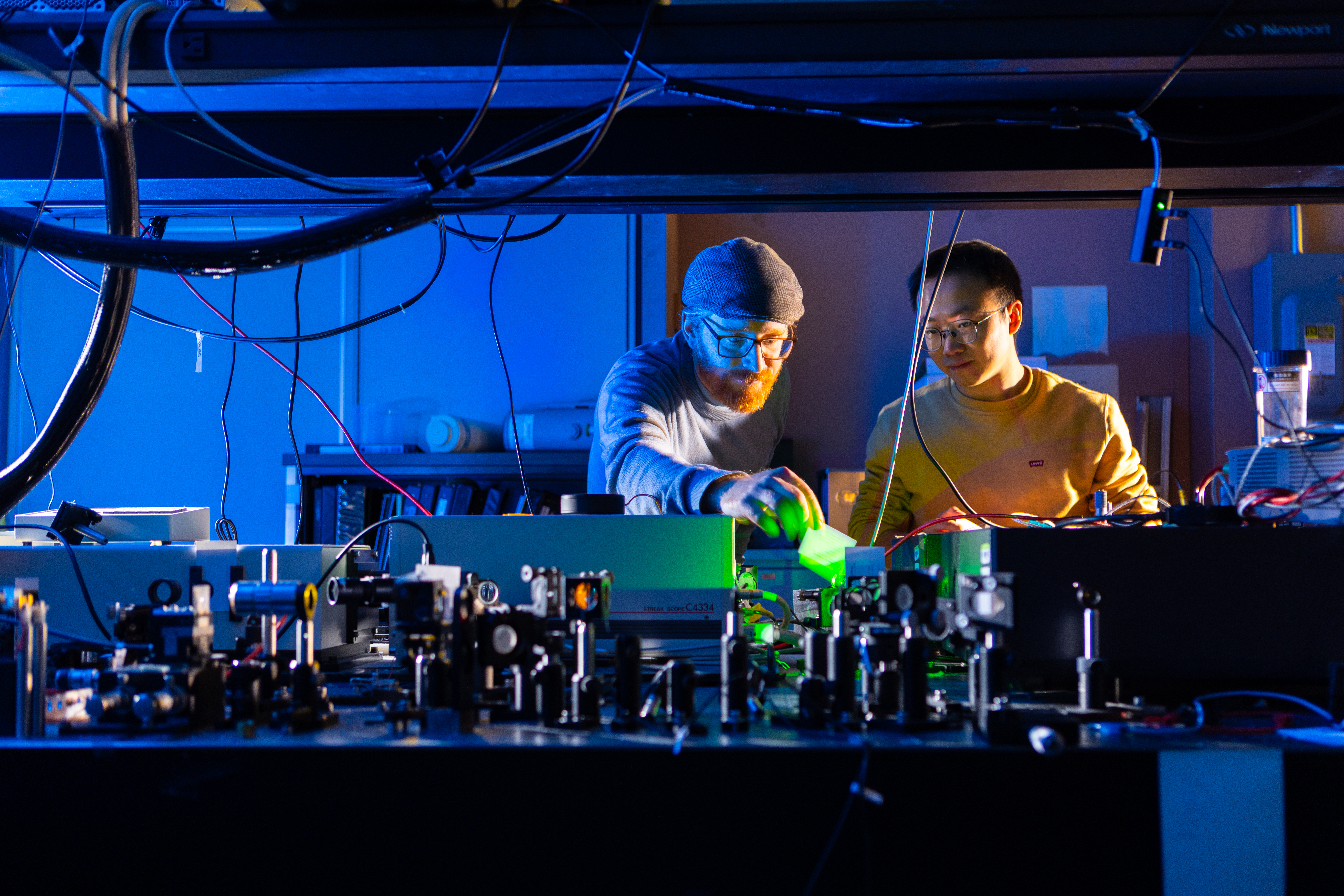 Tim Thomay instructs a student in the lab, Fronczak Hall
